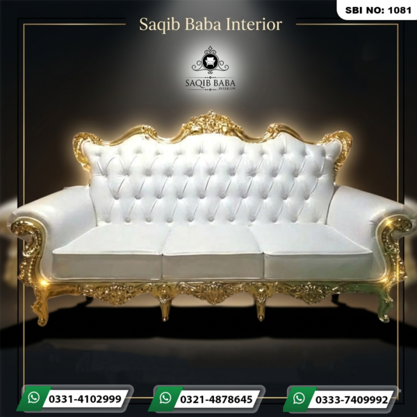 "An ornate royal 3-seater sofa by Saqib Baba Interior featuring an intricate gold carved frame and a white tufted leatherette backrest, perfect for wedding stages."