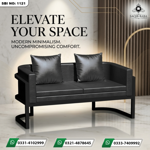 Contemporary black two-seater sofa with a matte black metal frame and matching cushions, placed against a luxury marble and wood-paneled background.