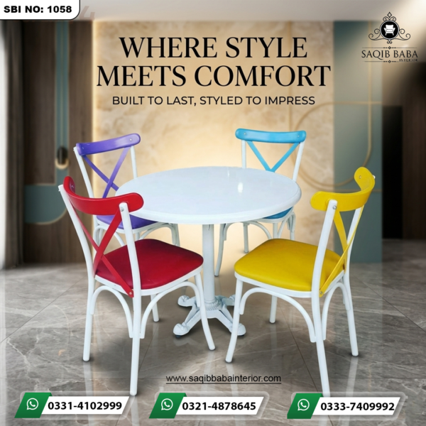 "A modern dining set featuring a white round pedestal table and four cross-back chairs in red, purple, blue, and yellow by Saqib Baba Interior."