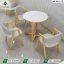 Modern luxury round marble cafe set with off white leatherette gold frame chairs and a round marble top table by Saqib Baba Interior
