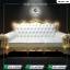 "An ornate royal 3-seater sofa by Saqib Baba Interior featuring an intricate gold carved frame and a white tufted leatherette backrest, perfect for wedding stages."